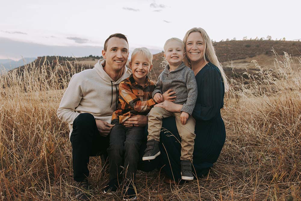 Dr. Allison Jung with her husband and two sons outdoors